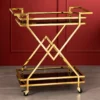 Xavia Luxe diamond frame serving trolley with gold structure and black serving surfaces