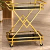 Xavia Luxe diamond frame serving trolley with gold structure and black serving surfaces