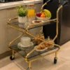 Zevora Luxe cross frame glass serving trolley with gold frame