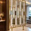 Hexara gold PVD room partition installed between modern living spaces