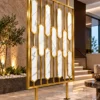Hexara luxury room partition with geometric gold PVD design in modern interior