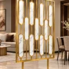 Hexara luxury room partition with geometric gold PVD design in modern interior