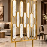 Hexara luxury room partition with geometric gold PVD design in modern interior