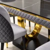 Close up of black marble dining table and gold U shaped stainless steel base
