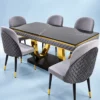 Modern black marble dining table set with grey upholstered chairs