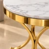 Close-up of white marble tabletop and gold stainless steel side table frame