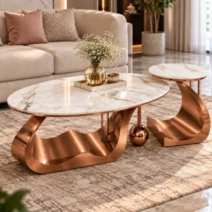 Luxury marble centre table set of 2 with copper curved bases styled on a rug in front of a beige living room sofa.