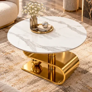 Top-angle view of round white marble coffee table with natural grey veining and decorative gold S-curve base.