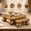 Aurevia Luxe gold sphere centre table promotional graphic highlighting premium materials, textured finish, spherical supports and durable construction.