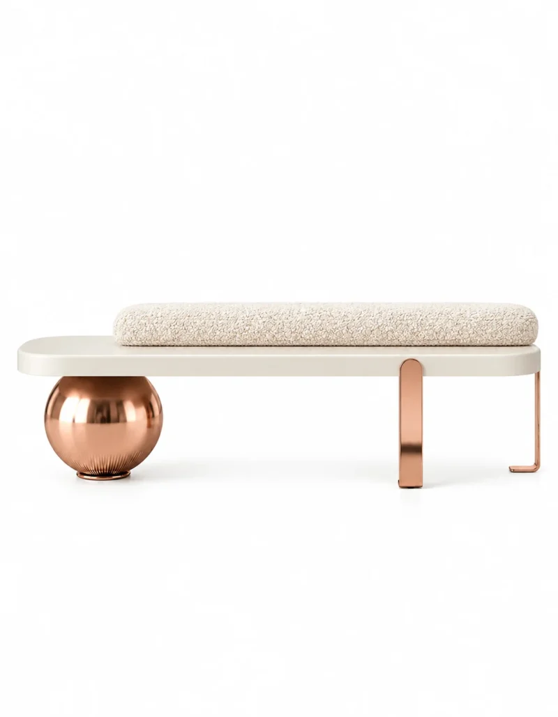 Aurevia Luxe luxury bouclé bench with ivory cylindrical cushion, cream platform, rose gold sphere and geometric stainless steel legs on white background.