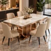 Designer six-seater marble dining table with rose-gold curved stainless steel base and cream chairs in a luxury dining room.