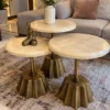 Luxury 3 piece marble side table set with gold pedestal bases in living room