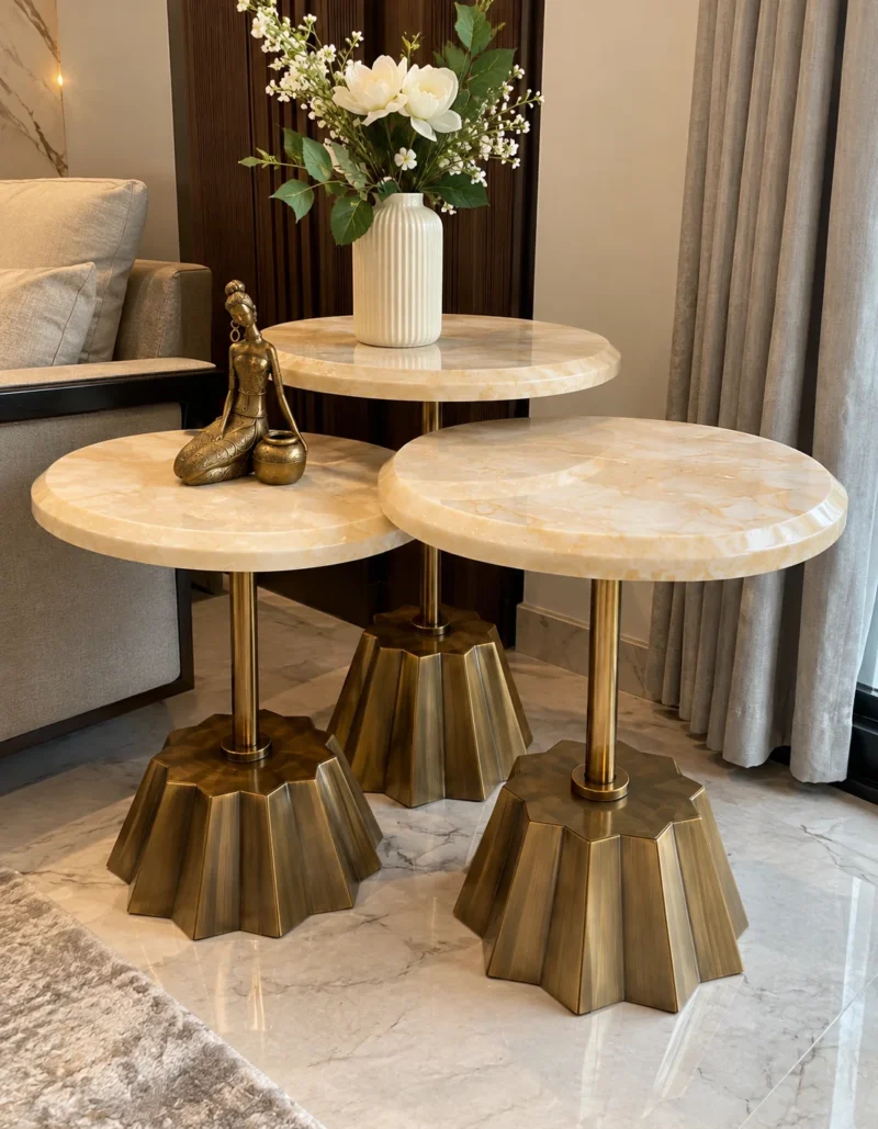 Modern marble side table set of three beside sofa and curtains