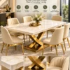 Cresvella Luxe curved X base marble dining table with gold stainless steel pedestal and upholstered chairs