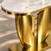 Close up of marble top and gold stainless steel console table base