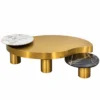 Elvessa Luxe sculptural gold centre table on white background with irregular stainless steel top, white marble accent and black marble side surface.