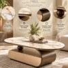 Elvoro oval marble centre table with white veined marble top, curved stainless steel base and decorative spherical support.