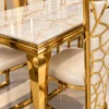 Close up of marble dining table and geometric gold chair