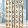 Gold PVD premix glas room divider with repeating floral quatrefoil pattern