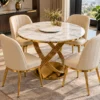 Luxury marble dining table set with four vertical stitched cream chairs and gold base