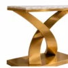 Close-up of curved gold stainless steel X base beneath marble console tabletop