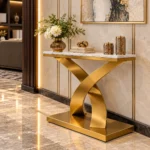 Luxury marble console table with curved gold pedestal in elegant entryway