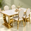White marble dining table with gold U shaped base and chairs