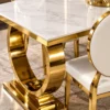 Close up of marble dining table with gold stainless steel base