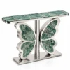 Mariposa Luxe green marble butterfly console table with polished silver stainless steel base isolated on a white background.