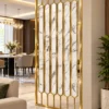Gold marble-design stainless steel partition between living and dining areas