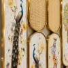 Close view of peacock artwork and cane style panels in gold room partition