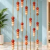 Gold stainless steel room partition with terracotta marble beads