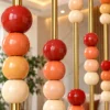 Close up of decorative marble beads on gold partition rods