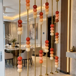 Floor to ceiling stainless steel partition with marble beads