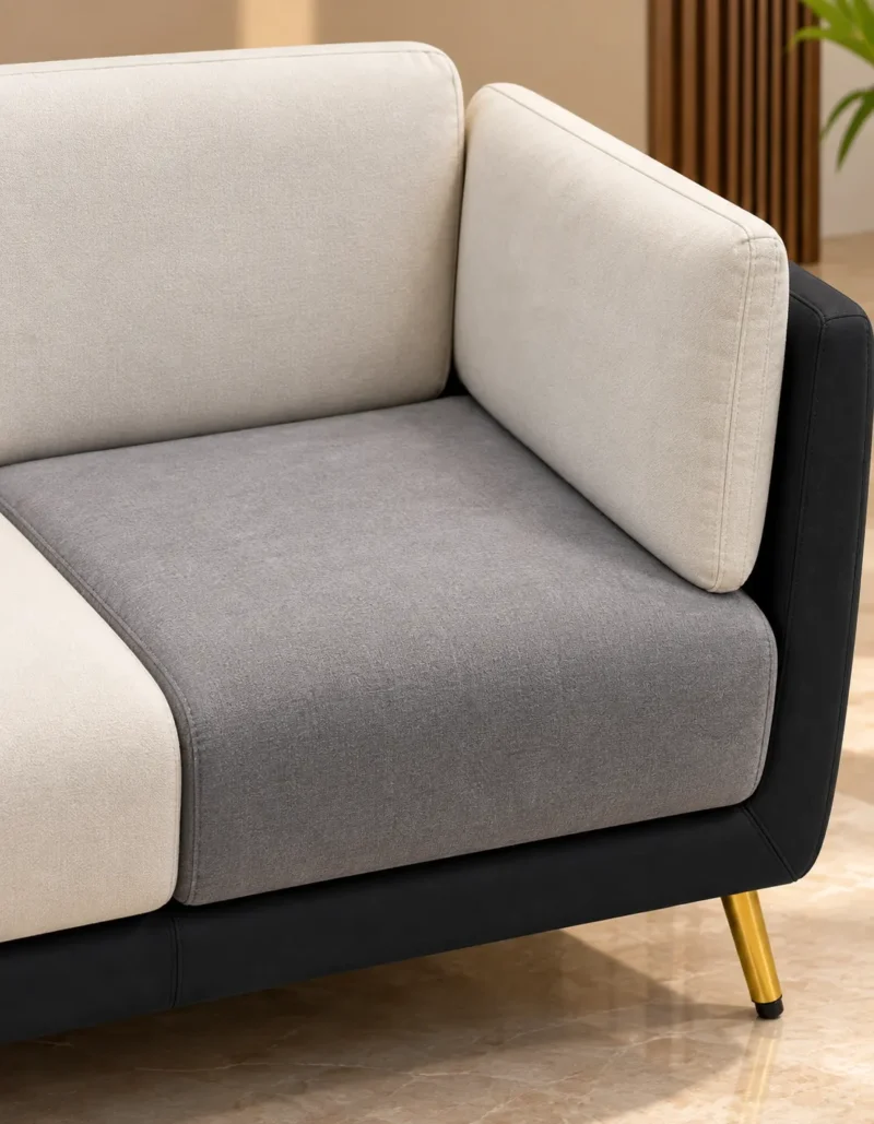 Close view of Monvera cream and grey sofa fabric and padded armrest