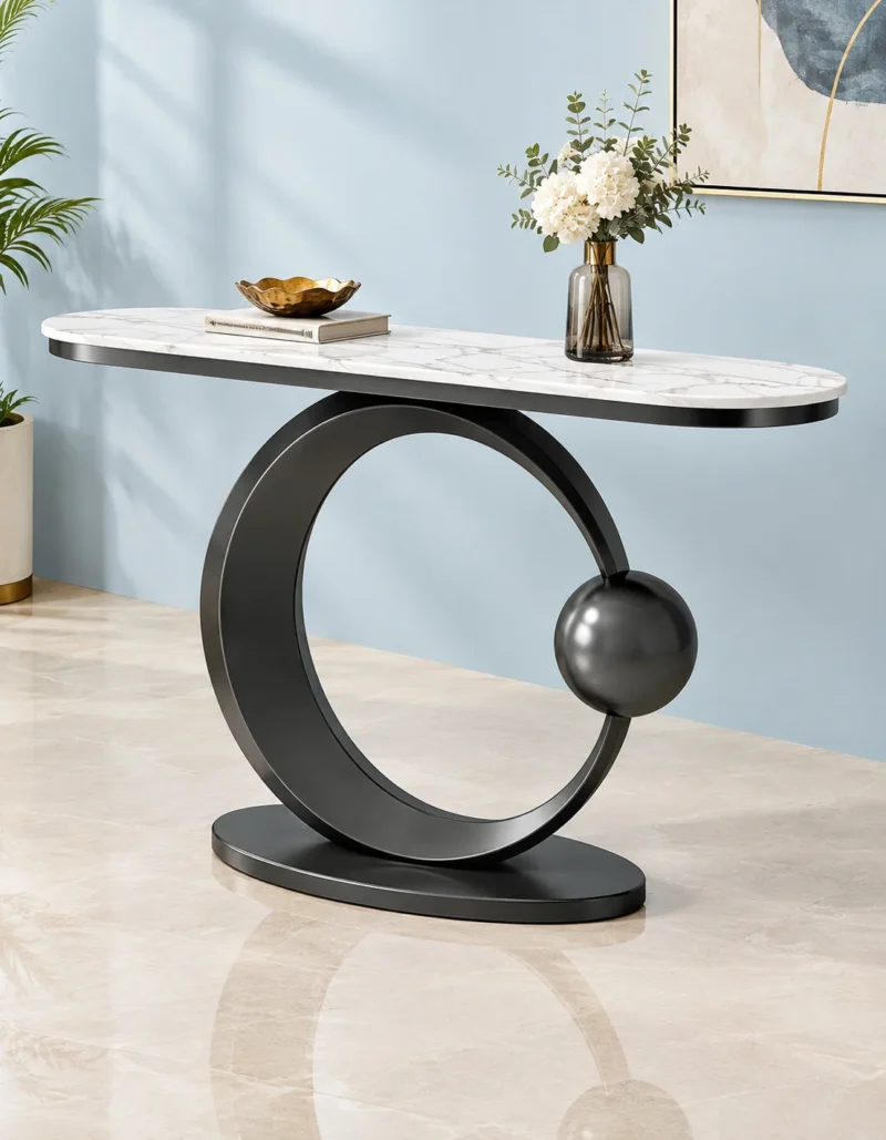 Designer marble top console table with matte black circular frame displayed against a light blue wall.