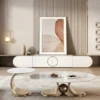 White marble-look centre table set of two with champagne metallic loop bases in a contemporary living room