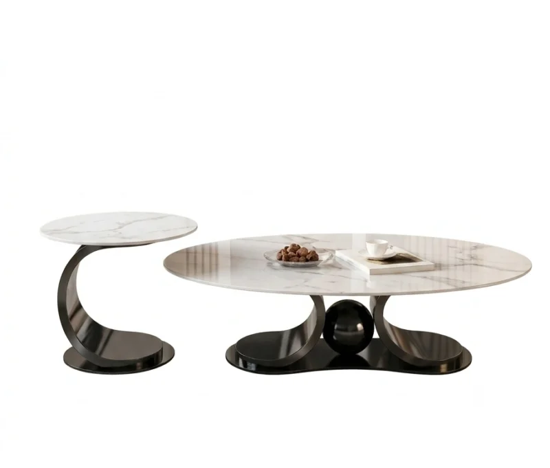 Matte black metallic curved base oval white marble coffee table set on seamless white studio background