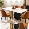 Orvella white marble dining table with black disc base