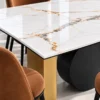 Close up of white marble dining table and black disc base