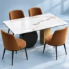 Luxury marble dining table with black disc base and four chairs