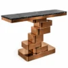 Orvello Luxe black marble console table with copper-tone stepped stainless steel pedestal and rectangular base on white background.