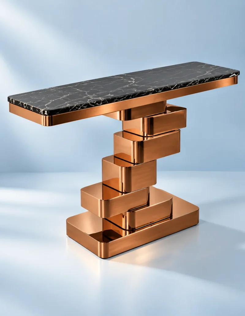 Sculptural black marble console table with offset copper-finish stainless steel blocks against a light blue studio background.
