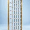 Angled view of gold stainless steel room divider with clear faceted beads