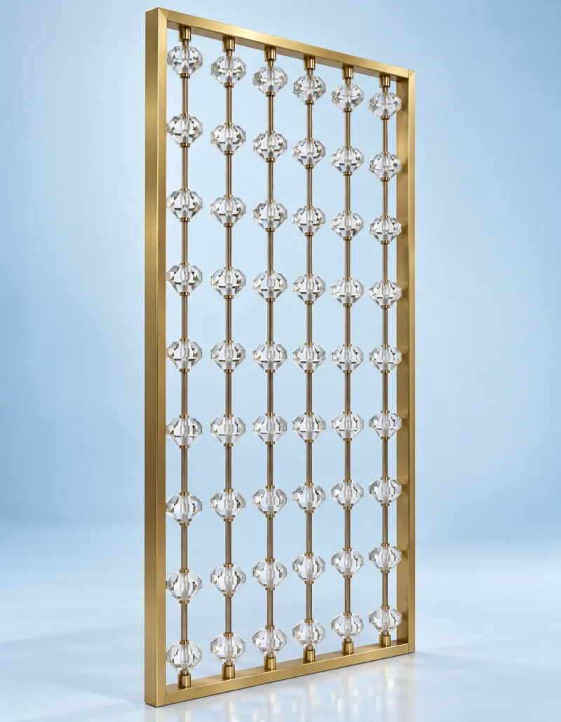 Angled view of gold stainless steel room divider with clear faceted beads