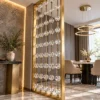 Gold framed crystal bead partition separating modern dining and living areas
