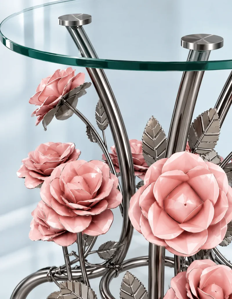 Close-up of pink sculptural metal roses and polished silver floral stems beneath a round glass side table