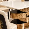 Close up of white marble dining table and gold stainless steel spiral base