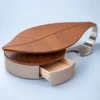 Sylvara sculptural leaf centre table with drawer and stainless steel detail