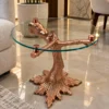 Luxury glass side table with rose gold tree trunk pedestal, decorative bear and spreading root-shaped base